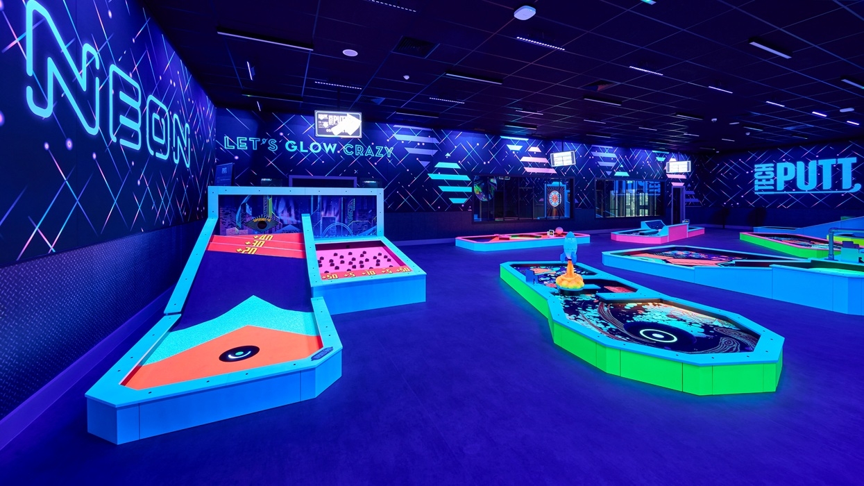 Neon-lit indoor mini golf course from 360Golf with vibrant colours and futuristic designs.
