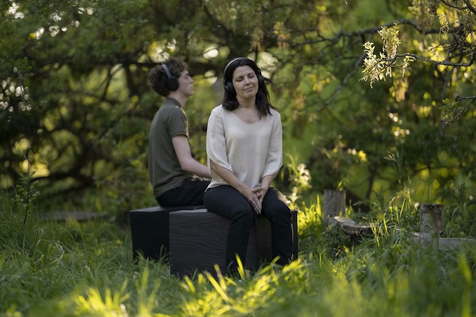 Of the Oak people listening with headphones on