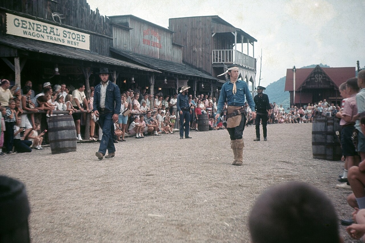 Old West street scene with cowboys performing for an outdoor audience at the now closed Ghost Town in the Sky amusement park