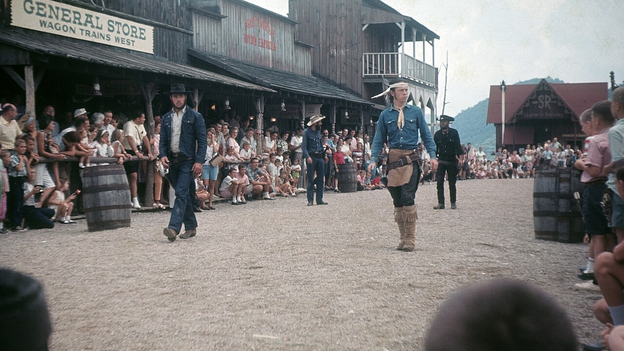 Old West street scene with cowboys performing for an outdoor audience at the now closed Ghost Town in the Sky amusement park