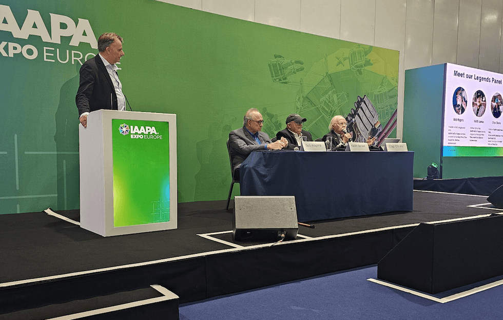 Panel discussion at IAAPA Expo Europe with four speakers on stage.