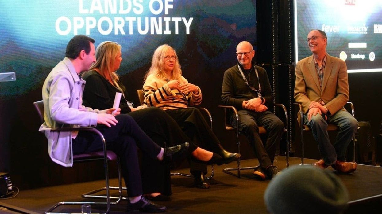 Panel discussion at Touring Entertainment LIVE with five people seated on stage.