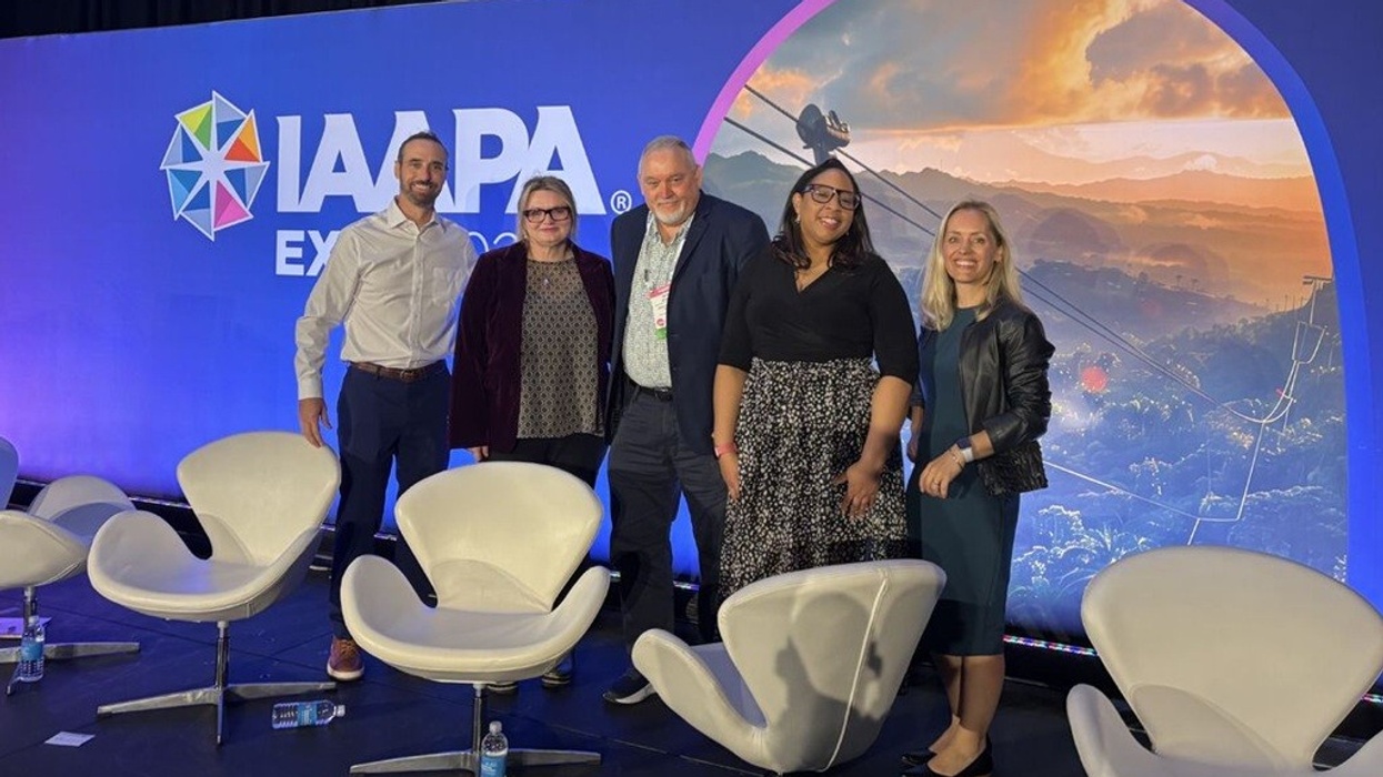 Paul Fontanelli; Founder at Bolder Adventure Texas, Susan Mudie, CEO at Rainbows End Theme Park; John Rouse, Chief of Aquarium and Visitor Operations at Aquarium of the Pacific; Bridgette Russell, Sr. Director of Marketing and Communications and Angie Judge, CEO at Dexibit speaking at IAAPA Expo with chairs and backdrop.
