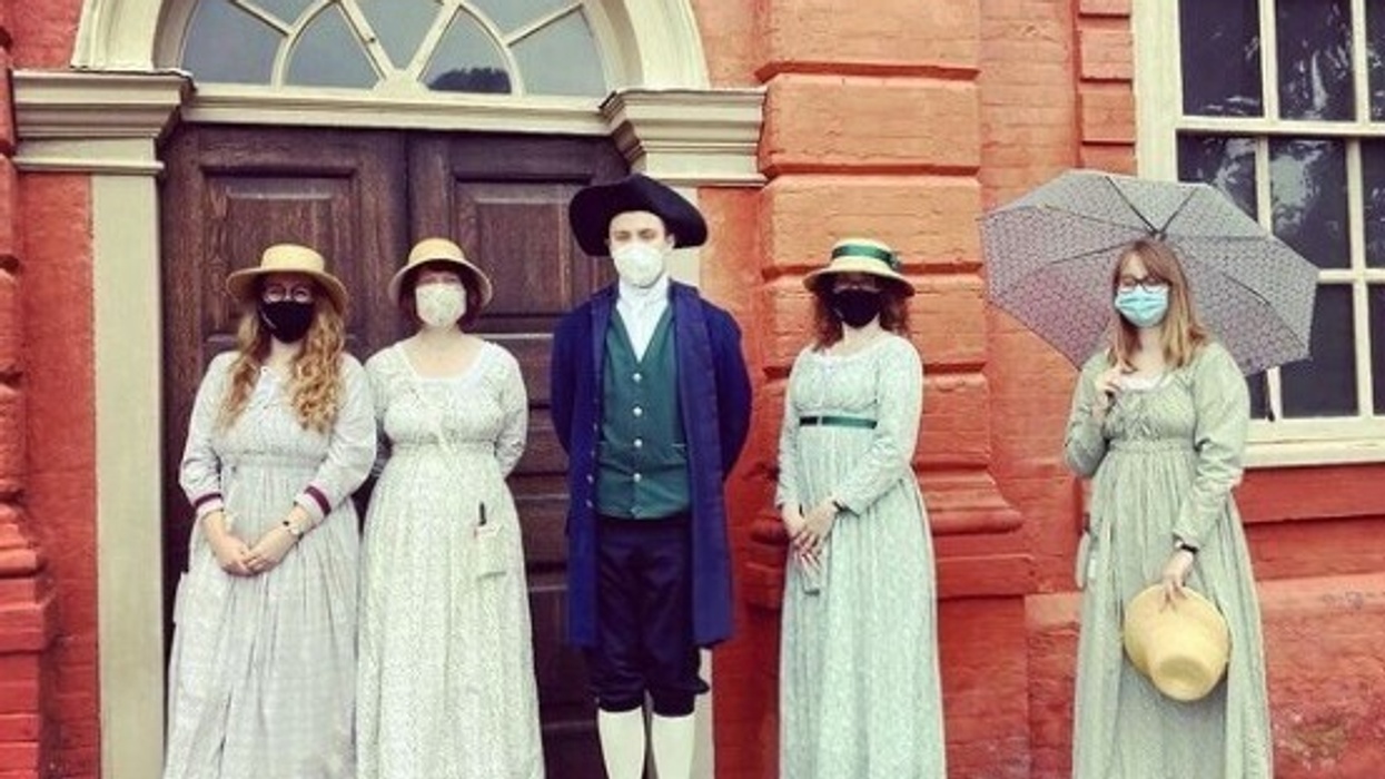 people dressed up outside building