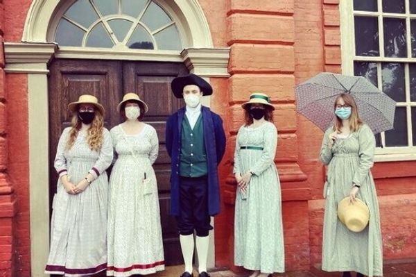 people dressed up outside building