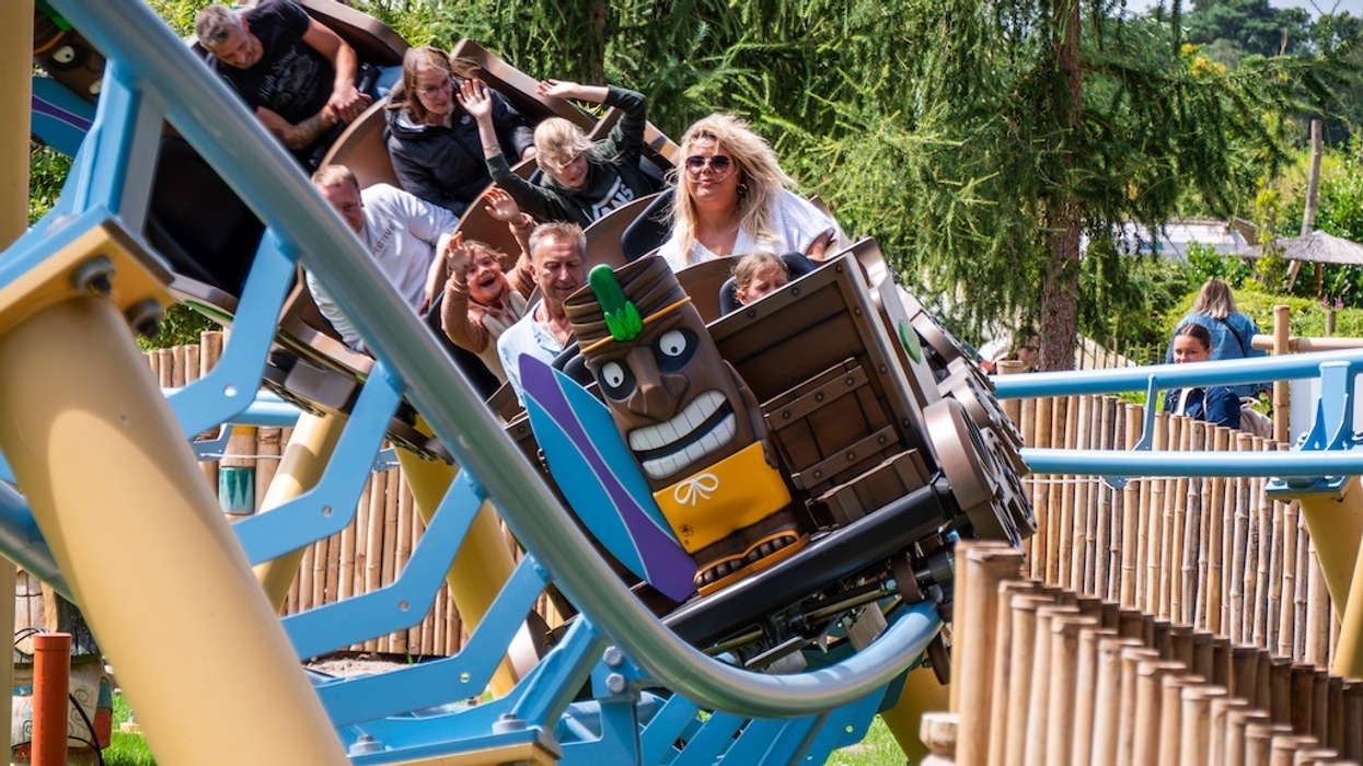 People enjoying a fun roller coaster ride Maui's Peak, in a colourful park setting, at Tier- und Freizeitpark Thüle