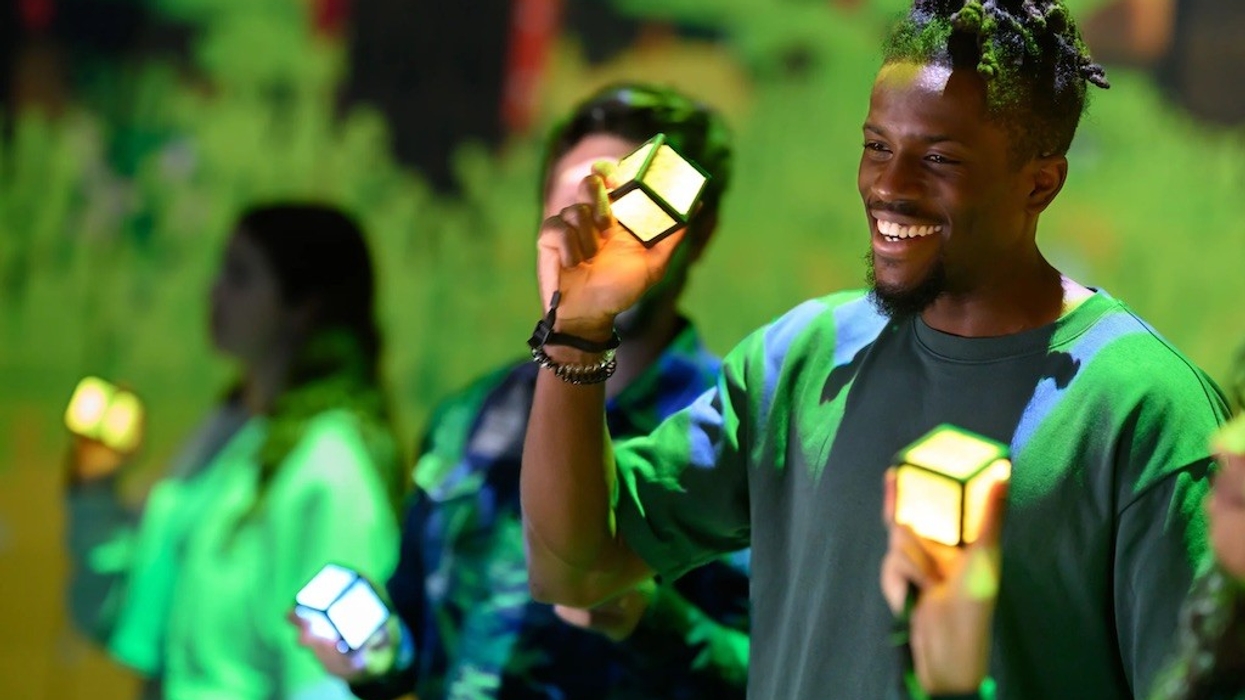 People holding glowing cubes against a vibrant, green-lit background in Minecraft Experience: Villager Rescue