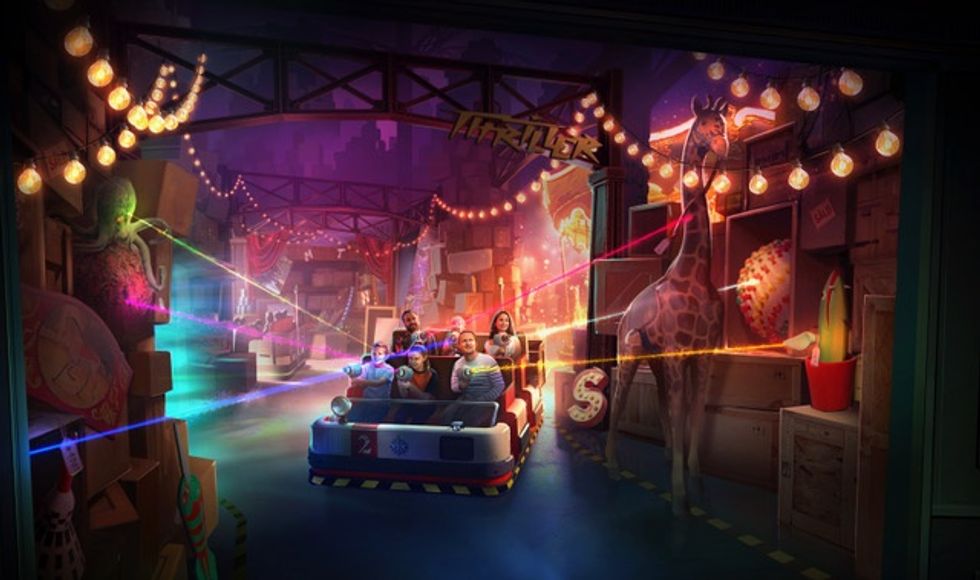 People in a ride shooting at colorful targets with an octopus and giraffe nearby.