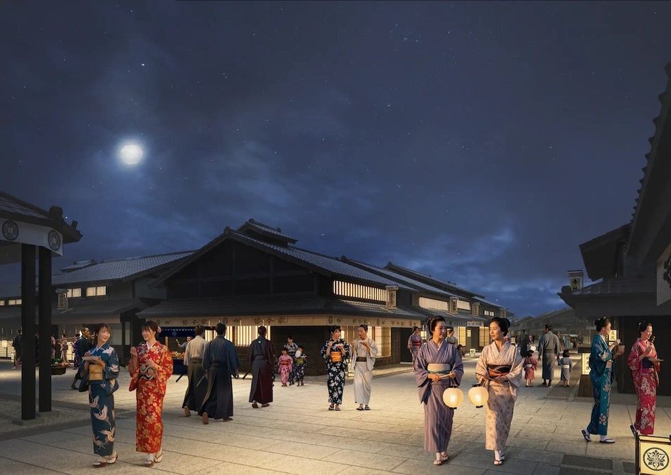 People in kimonos walking under moonlit sky in a traditional Japanese street.