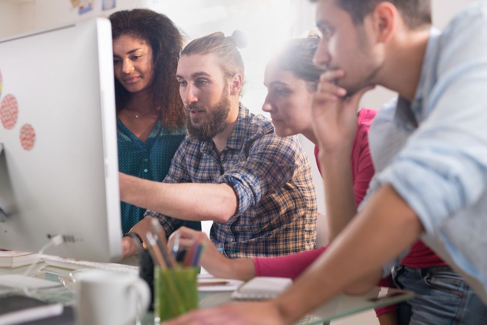 people-look-at-design-on-computer-screen