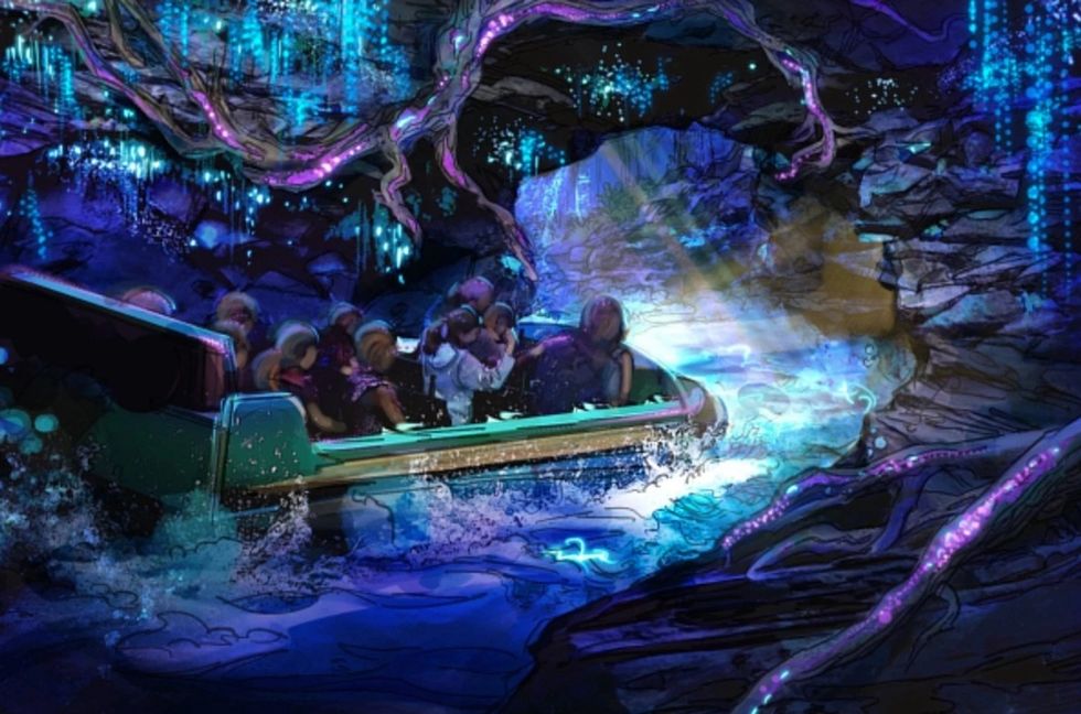 People on a boat ride called NightFlight Expedition at Dollywood through a glowing, colorful cave with neon-like flora.
