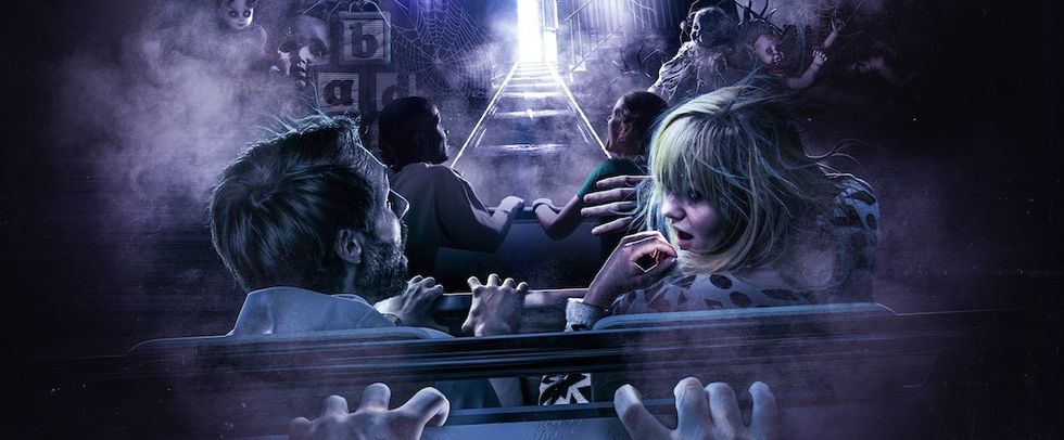 People on a dark ride, looking frightened as eerie figures surround them in a misty atmosphere.