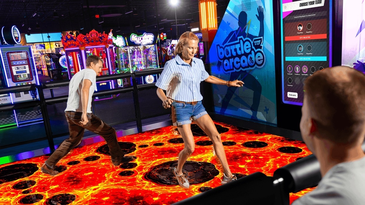People playing a virtual lava floor game on a Battle Arcade attraction.