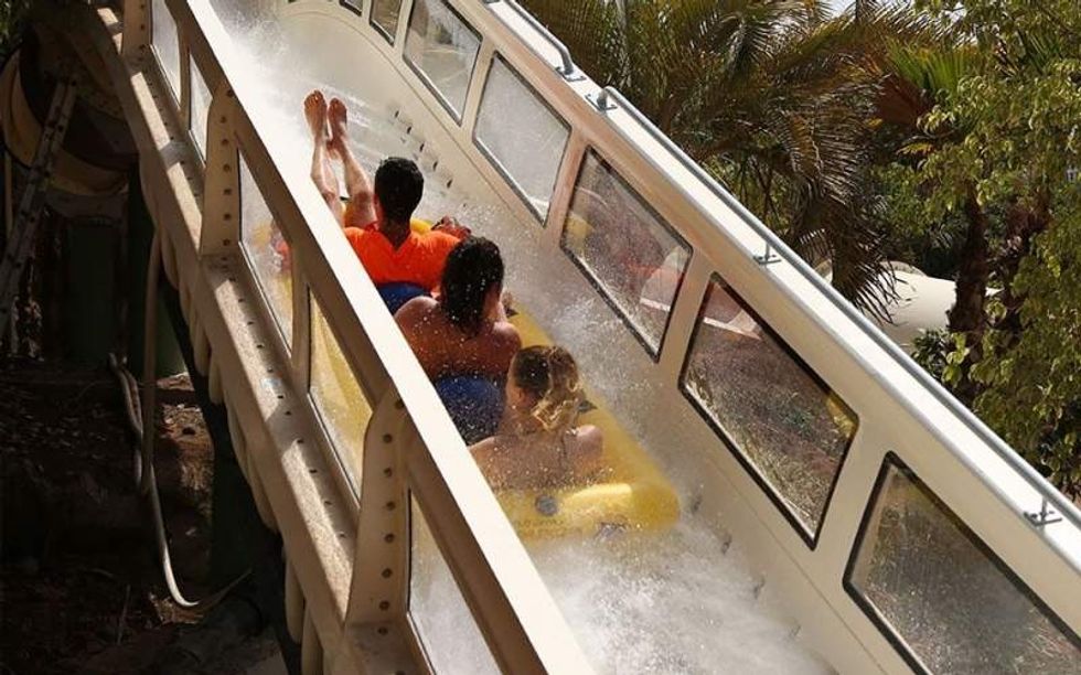 people riding proslide rocketblast water coaster