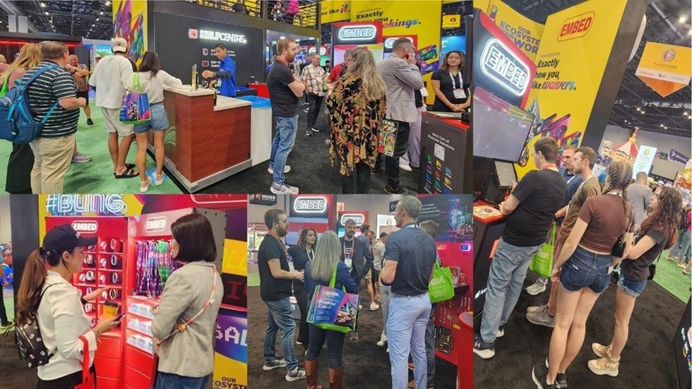 People visiting colorful booths at a lively trade show.