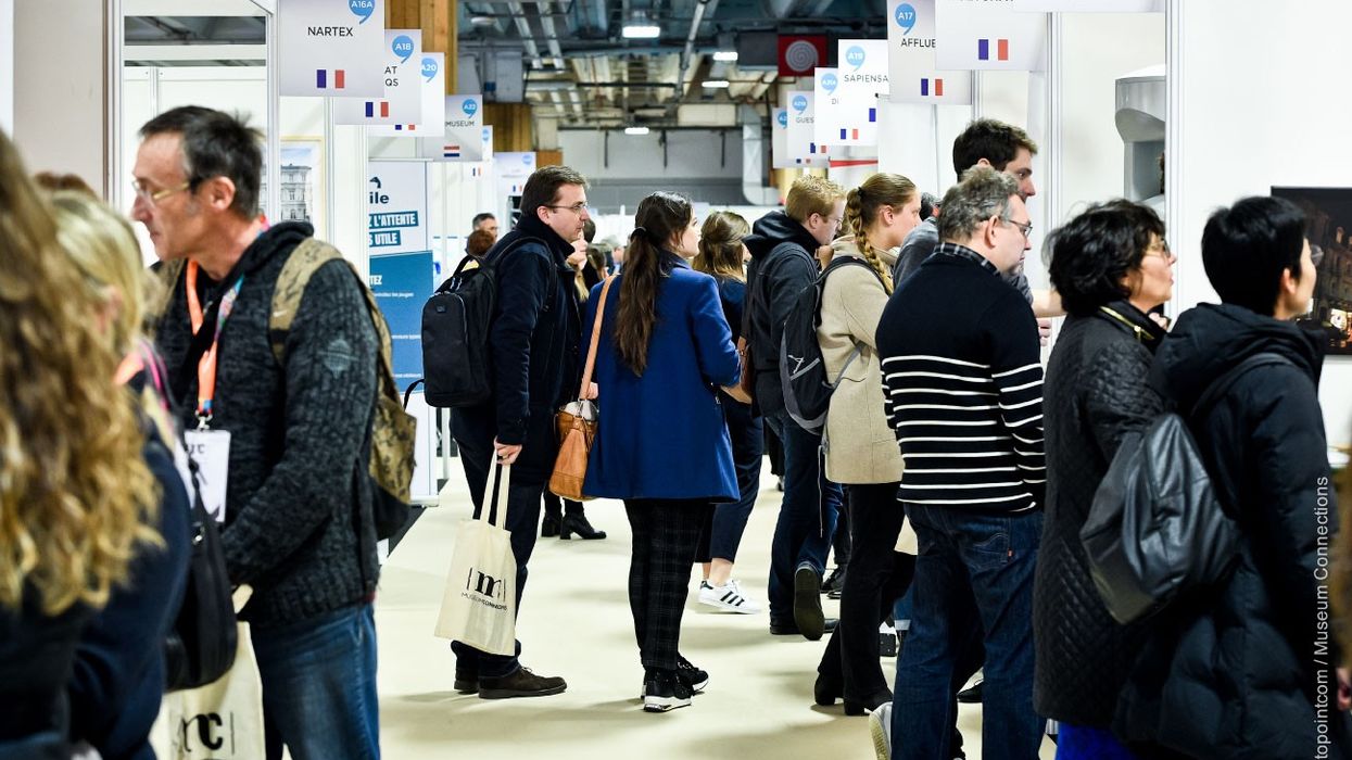 people walking around musuem connections trade floor