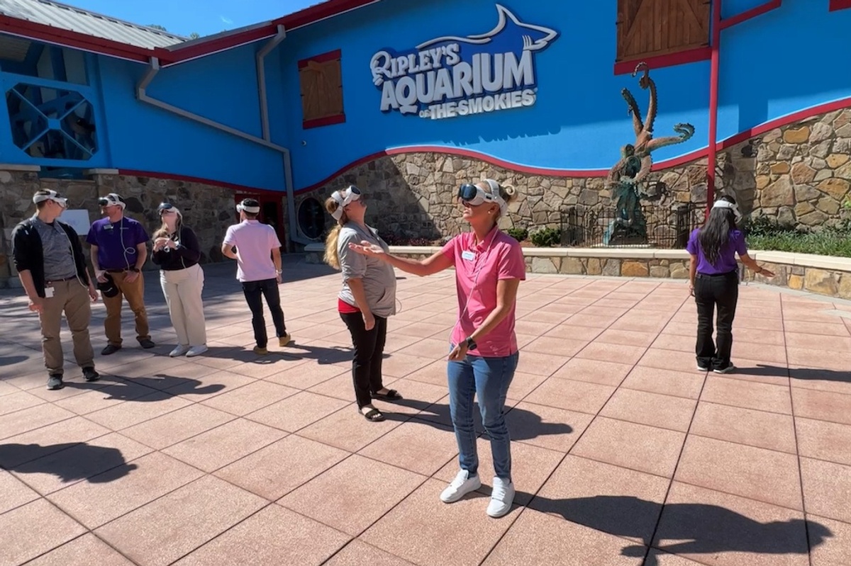 People with VR headsets outside Ripley's Aquarium of the Smokies.