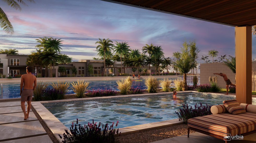 Person by a pool at sunset, surrounded by palm trees and lush greenery.