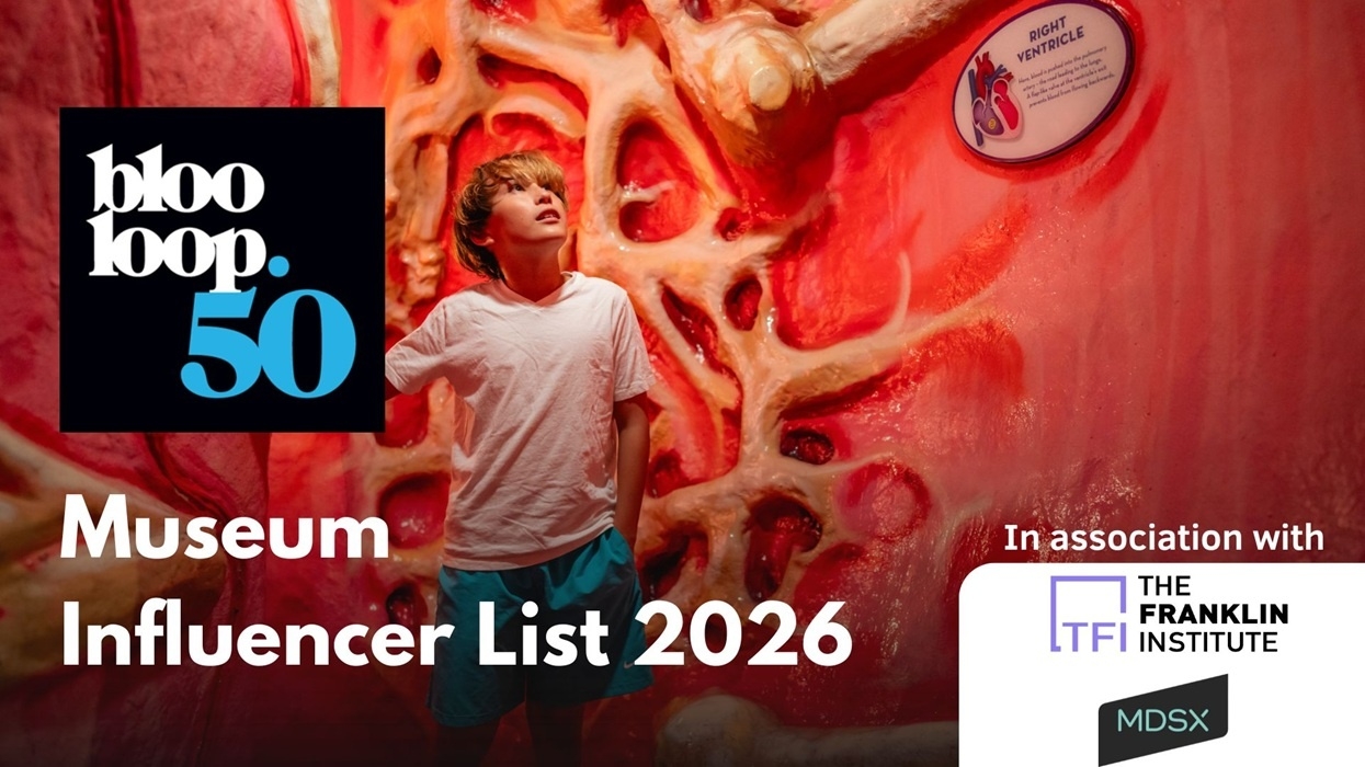 Person in museum exhibit; text: "blooloop 50 Museum Influencer List 2026."