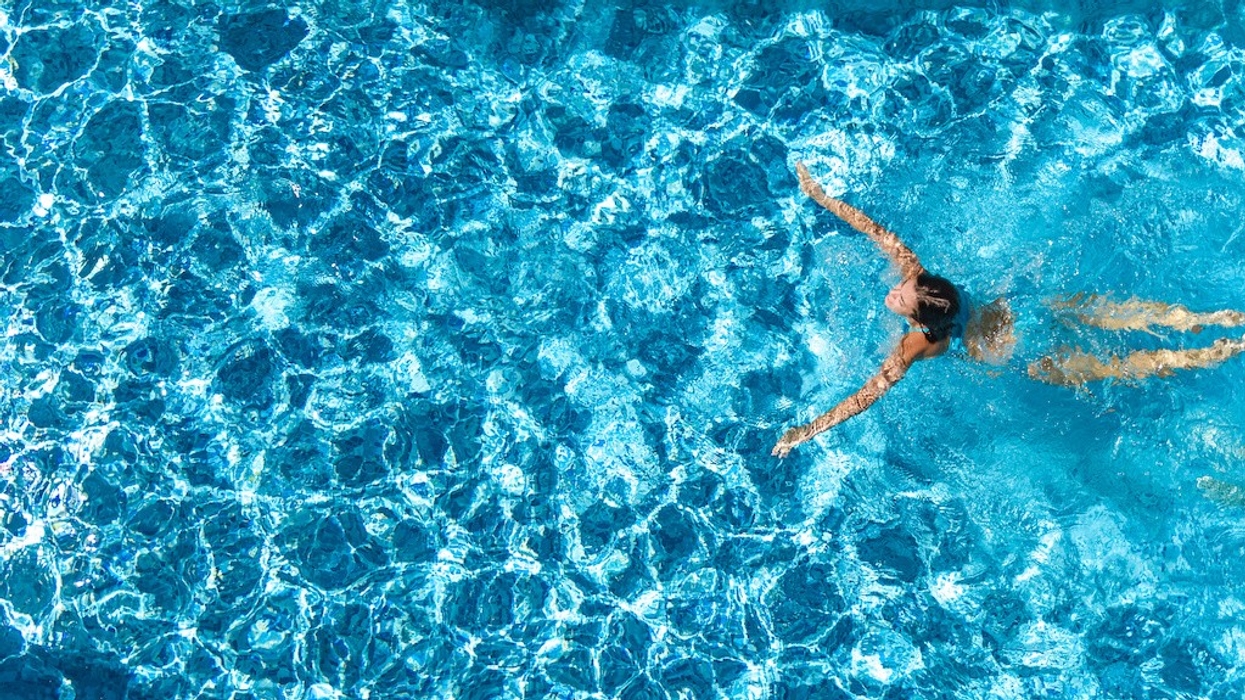 Person in swimming pool aerial view