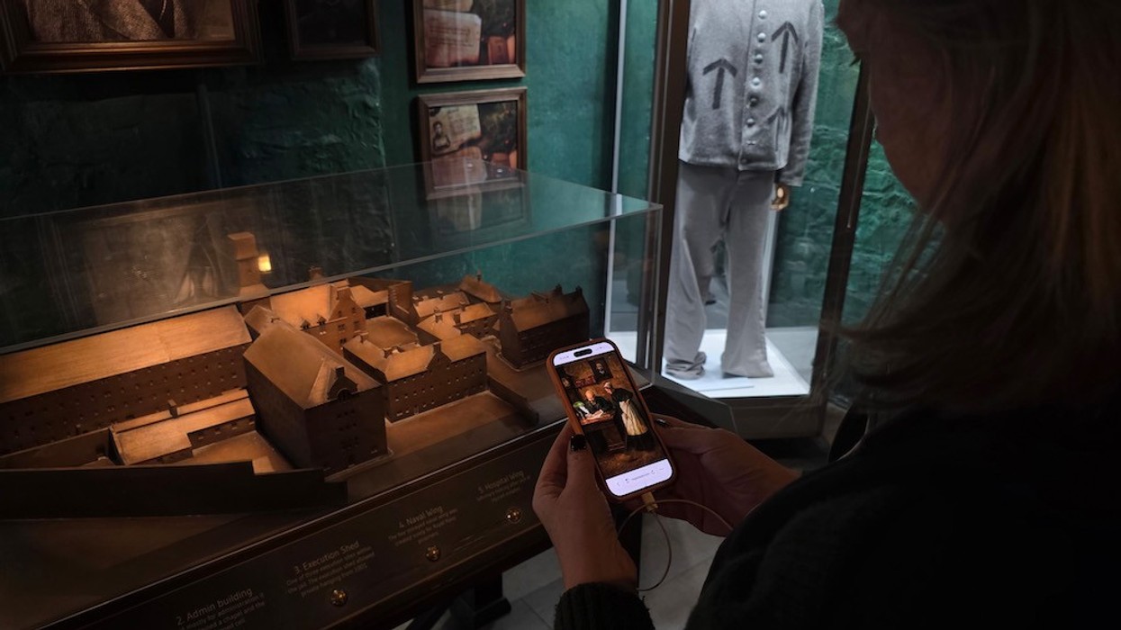 Person listening to audio tour while touring Bodmin Jail