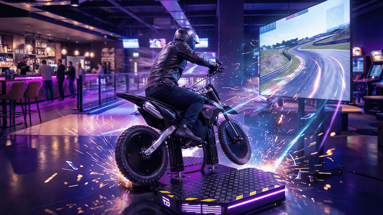 Person on motorcycle simulator in neon arcade, sparks flying, screen showing race track.