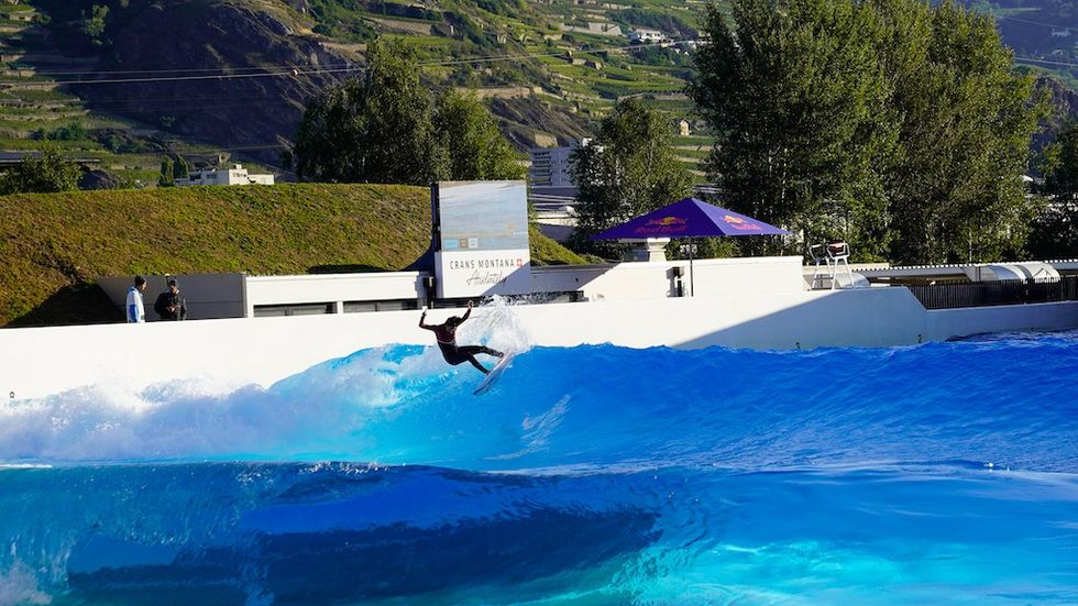 Person surfing with an outdoor LED screen using CheckMySurf from wavegarden