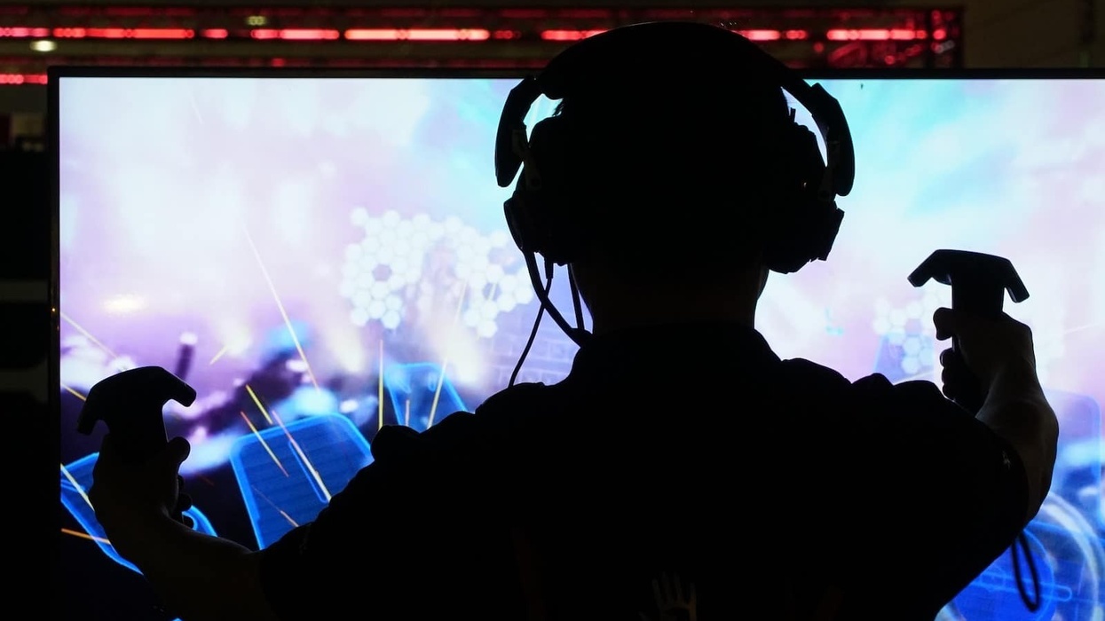 Person wearing VR headset playing game