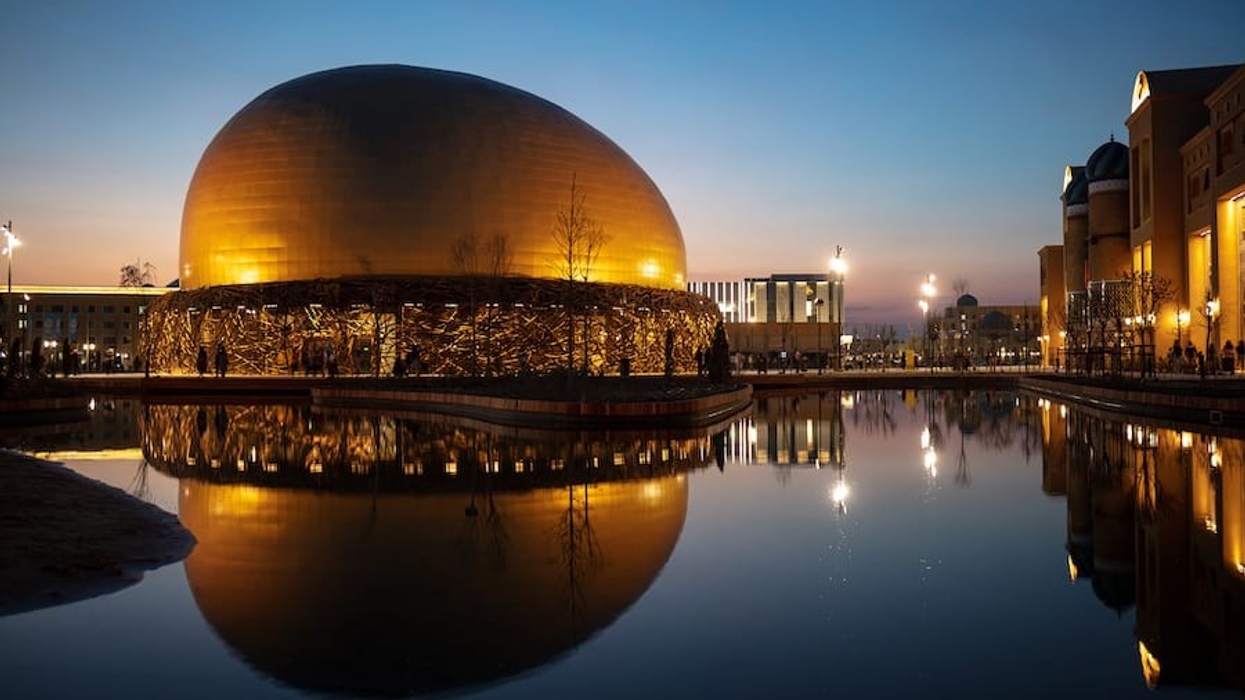 photo of golden flying theatre dome at Karavan Saray at sunset