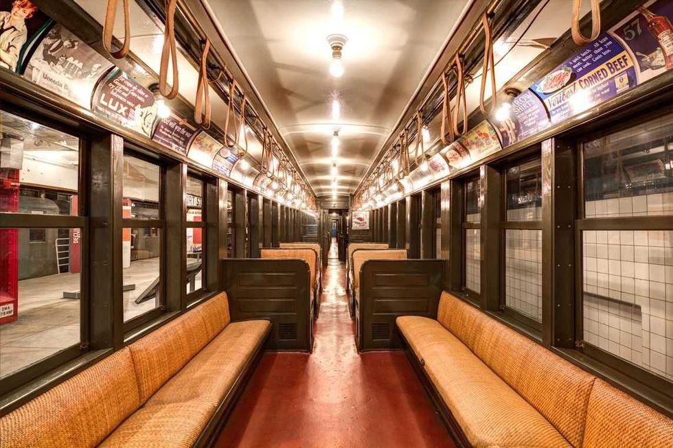 Photo of the interior of a train carriage in the New York Transit Museum