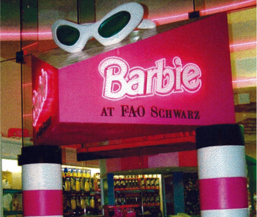 Pink Barbie sign with sunglasses at FAO Schwarz store display.