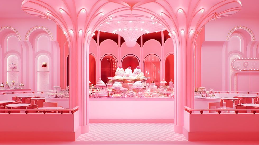 Pink-themed dessert caf\u00e9 with ornate designs and various sweets on display.