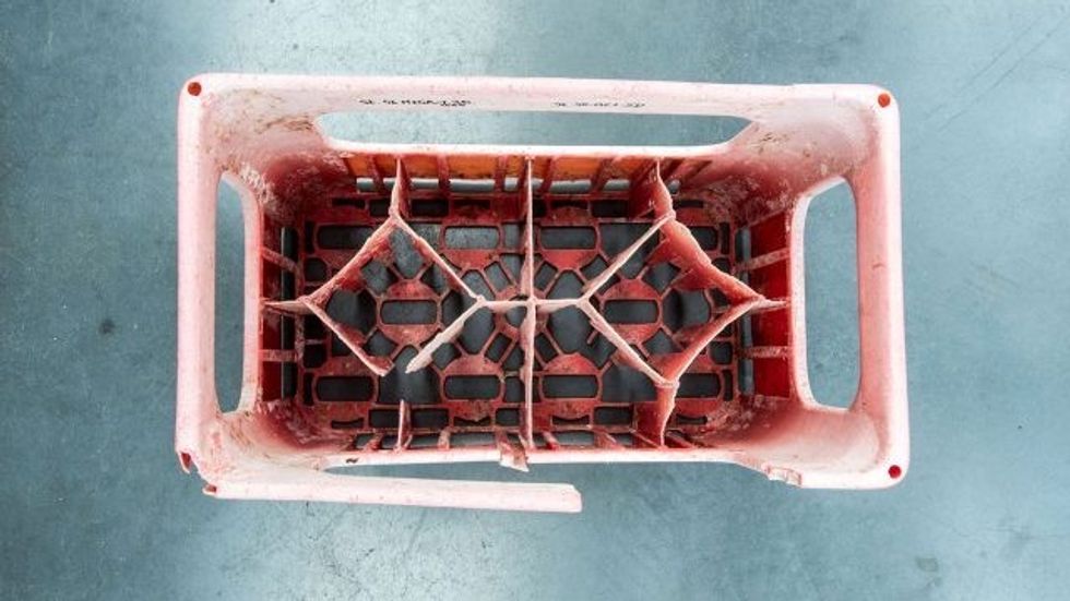 plastic pollution - crate found in the ocean made in 1977