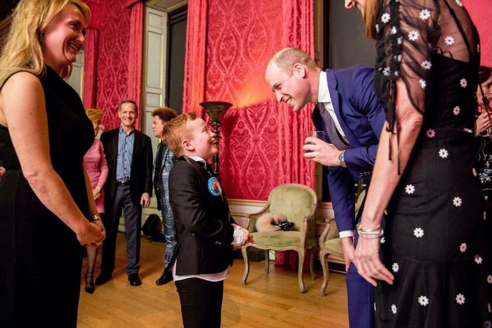 Prince William meets a young fan at a BAFTA event