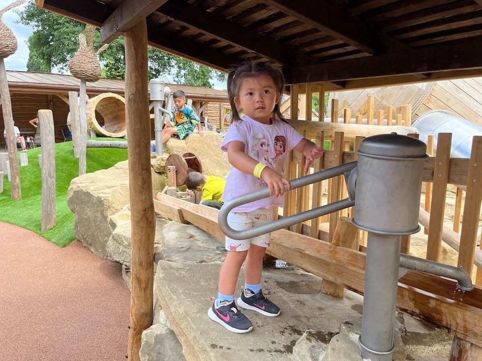 Pumping-up-the-water-by-hand-with-the-amazing-Courtyard-Play-for-Toddlers-at-Windsor-Great-Park