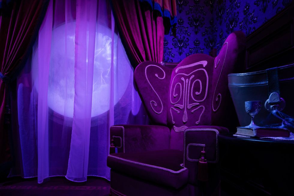 Purple-lit room with ornate chair, sheer curtains, and glowing circular window.
