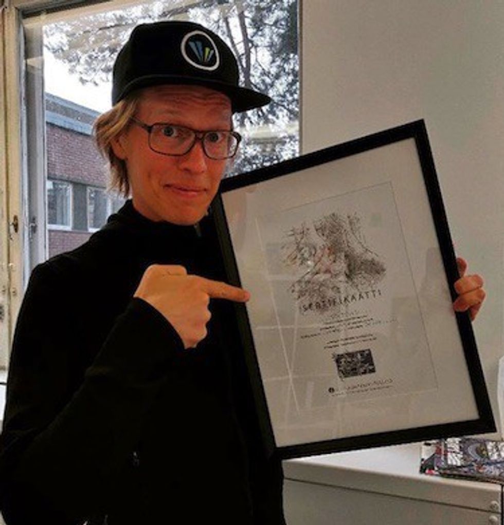 Raine Kajastila, CEO of Valo Motion, with certificate after donating for ancient Finnish forests