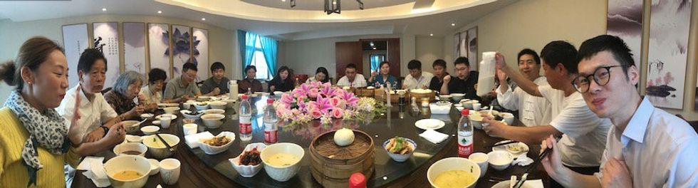 Raven Sun Creative shares remote work tips. Panorama of business meeting meal time
