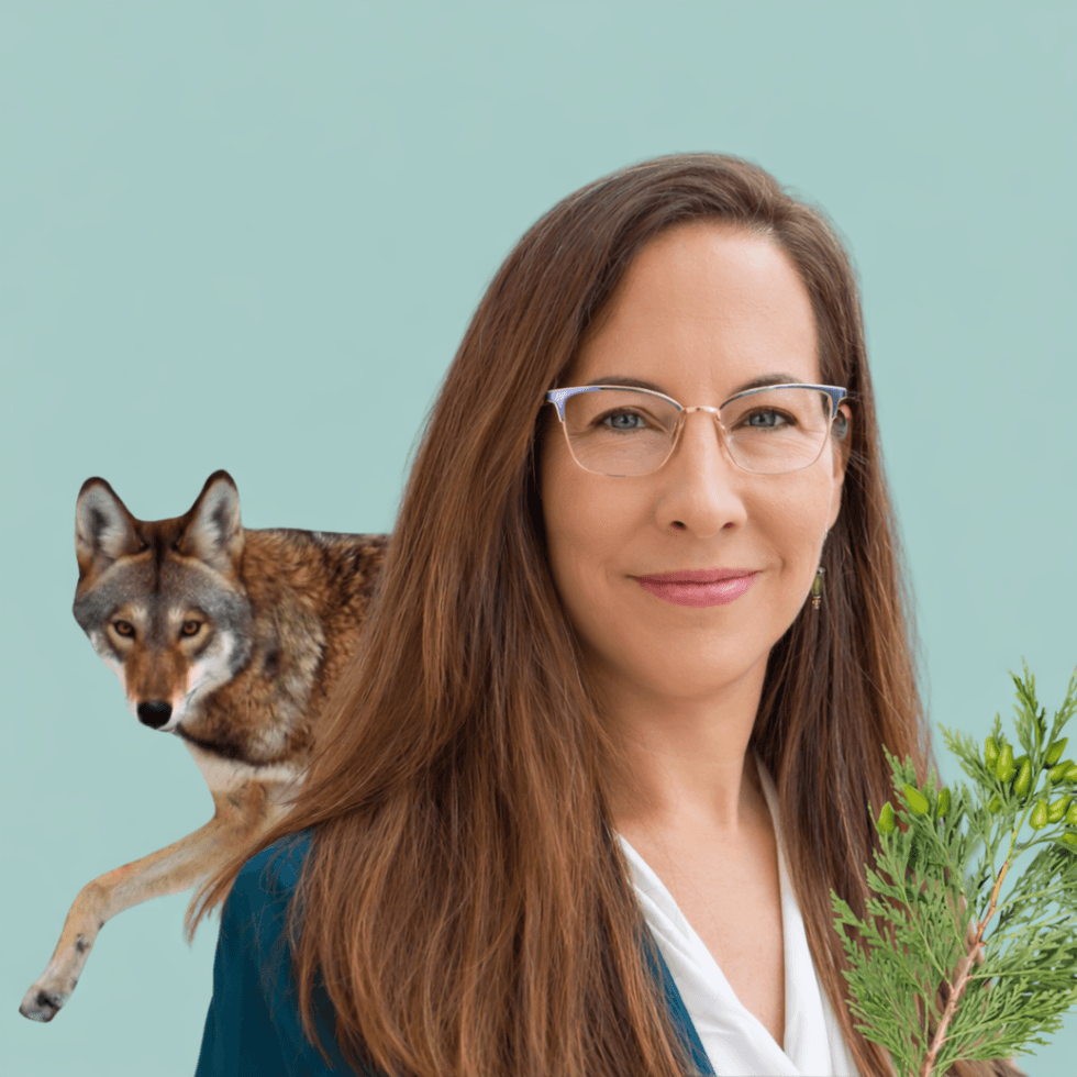 Regina Mossotti headshot. Woman with glasses holding greenery, red wolf in the background, teal backdrop.
