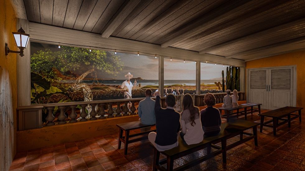 Rendering for Balashi Beer Experience shows people sitting indoors watching an outdoor beach scene with a man in a hat.