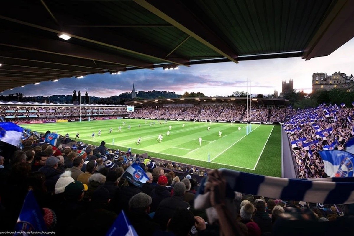 Rendering of crowd in proposed Bath Rugby stadium watching a rugby match at sunset, waving blue and white flags.