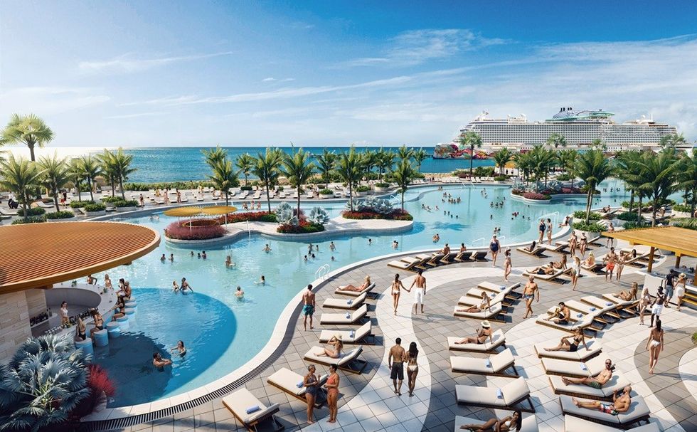 Resort pool area with loungers, palm trees, ocean, and cruise ship in the background.