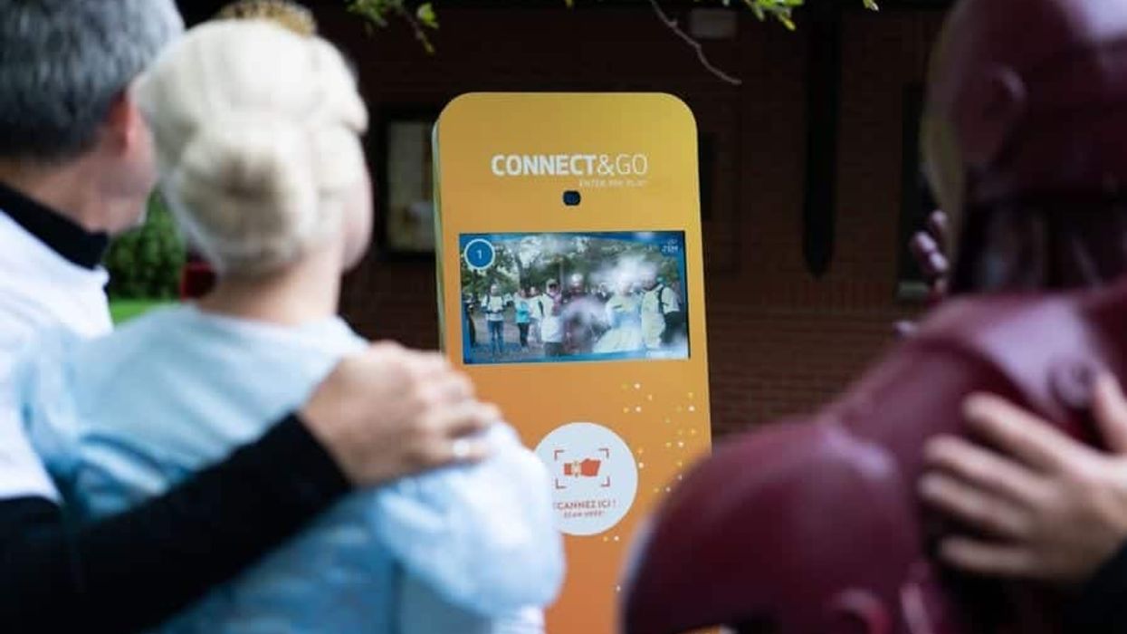 Revivre event guests taking a picture with Connect&GO's RFID solution