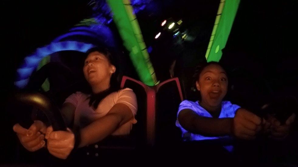 riders on a rollercoaster location-based entertainment jpeg
