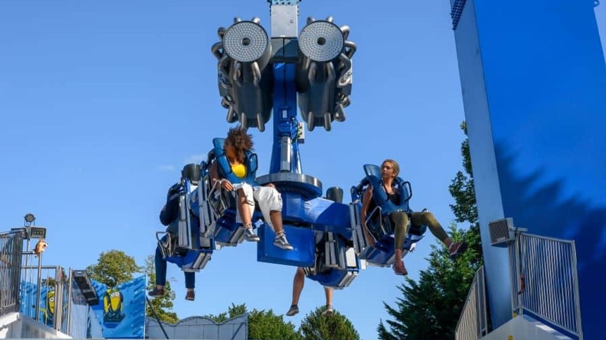 Riders on Booster Unhinged ride entertainment