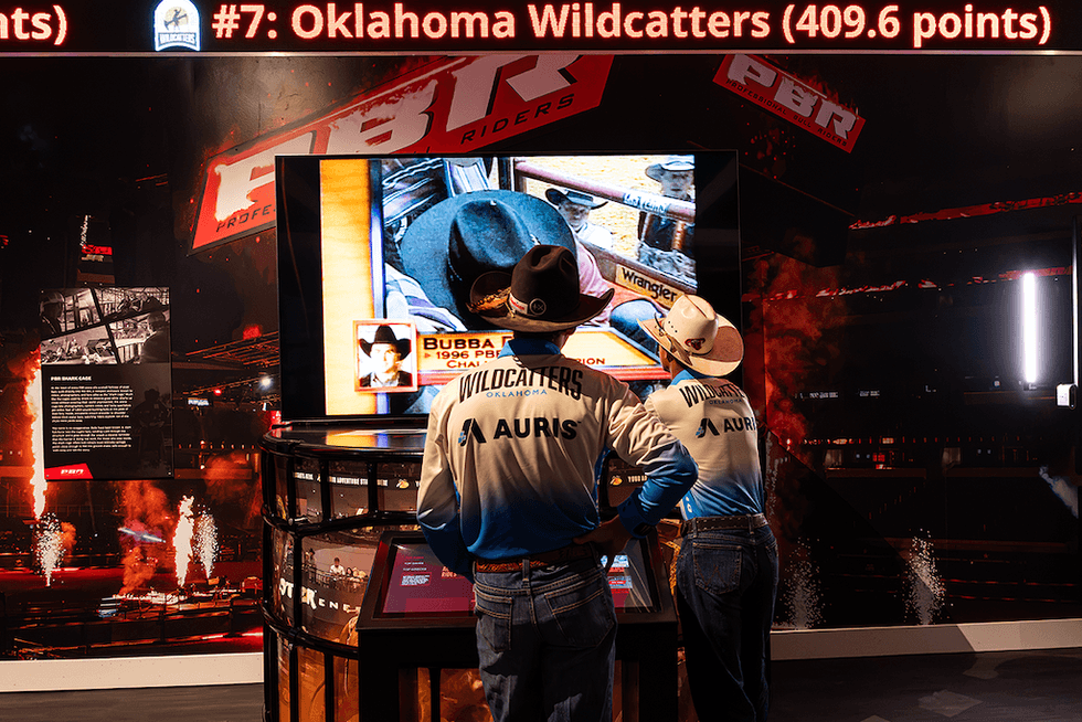 Riders watch a bull riding event video at the The National Cowboy & Western Heritage Museum