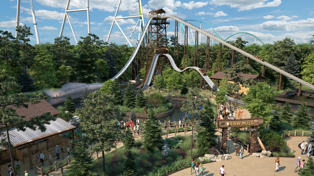 Rip Roarin' Falls Carowinds in a lush, green amusement park with people walking below
