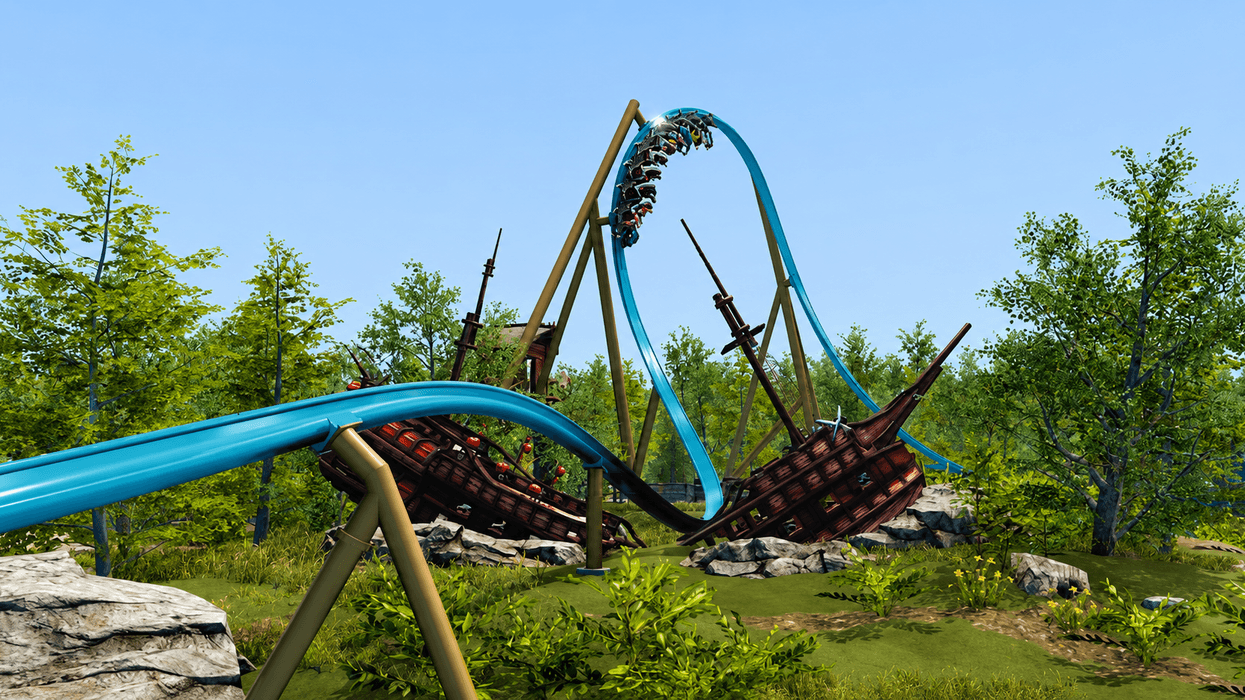 Roller coaster at Djurs Sommerland with blue track passes over shipwreck scene in a lush forest setting.