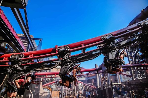 roller coaster riders going uphill