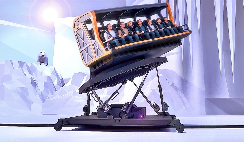 Rollercoaster simulator aligned with snow-themed background and mechanical base.